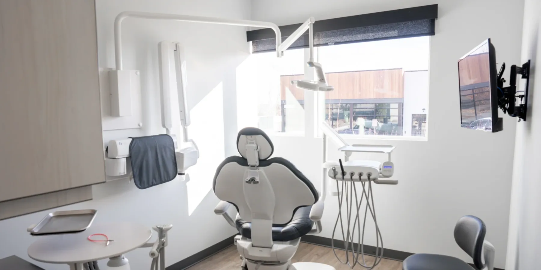 Mountain View treatment room with a dental chair beside a large window | Complete Smiles-Cottonwood Heights-Mountain View-Redwood-Utah
