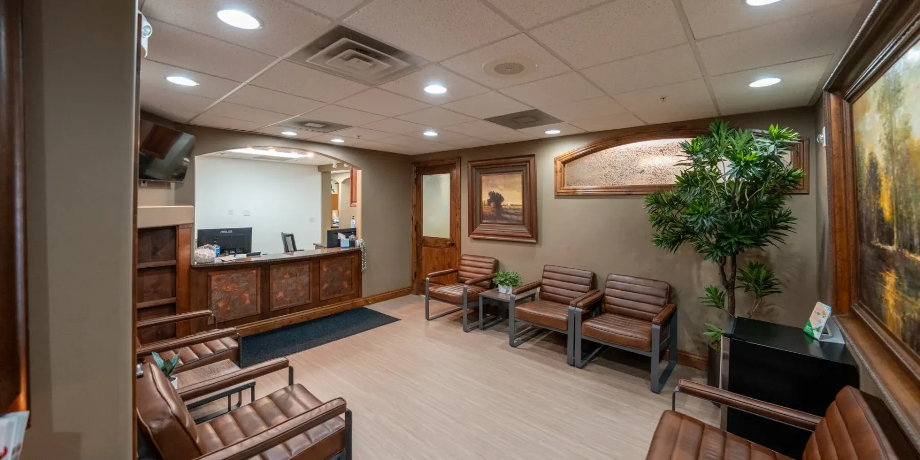 Redwood front desk and check-in counter with wood cabinetry | Complete Smiles-Cottonwood Heights-Mountain View-Redwood-Utah