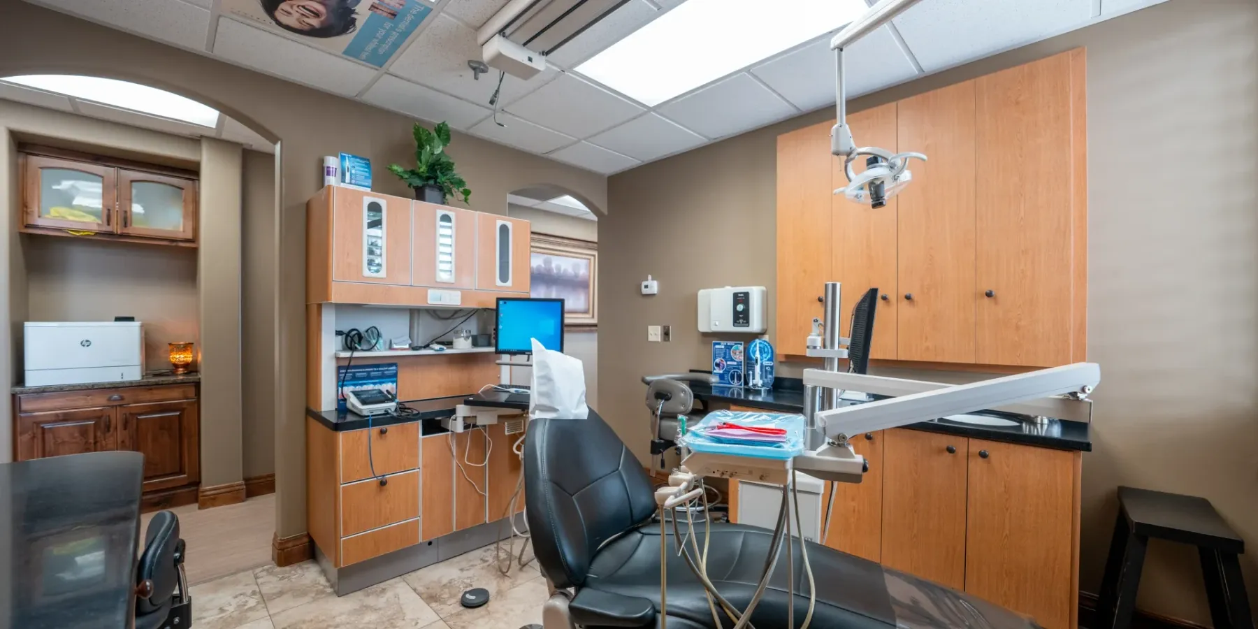 Redwood treatment room with a wall-mounted TV above the chair | Complete Smiles-Cottonwood Heights-Mountain View-Redwood-Utah