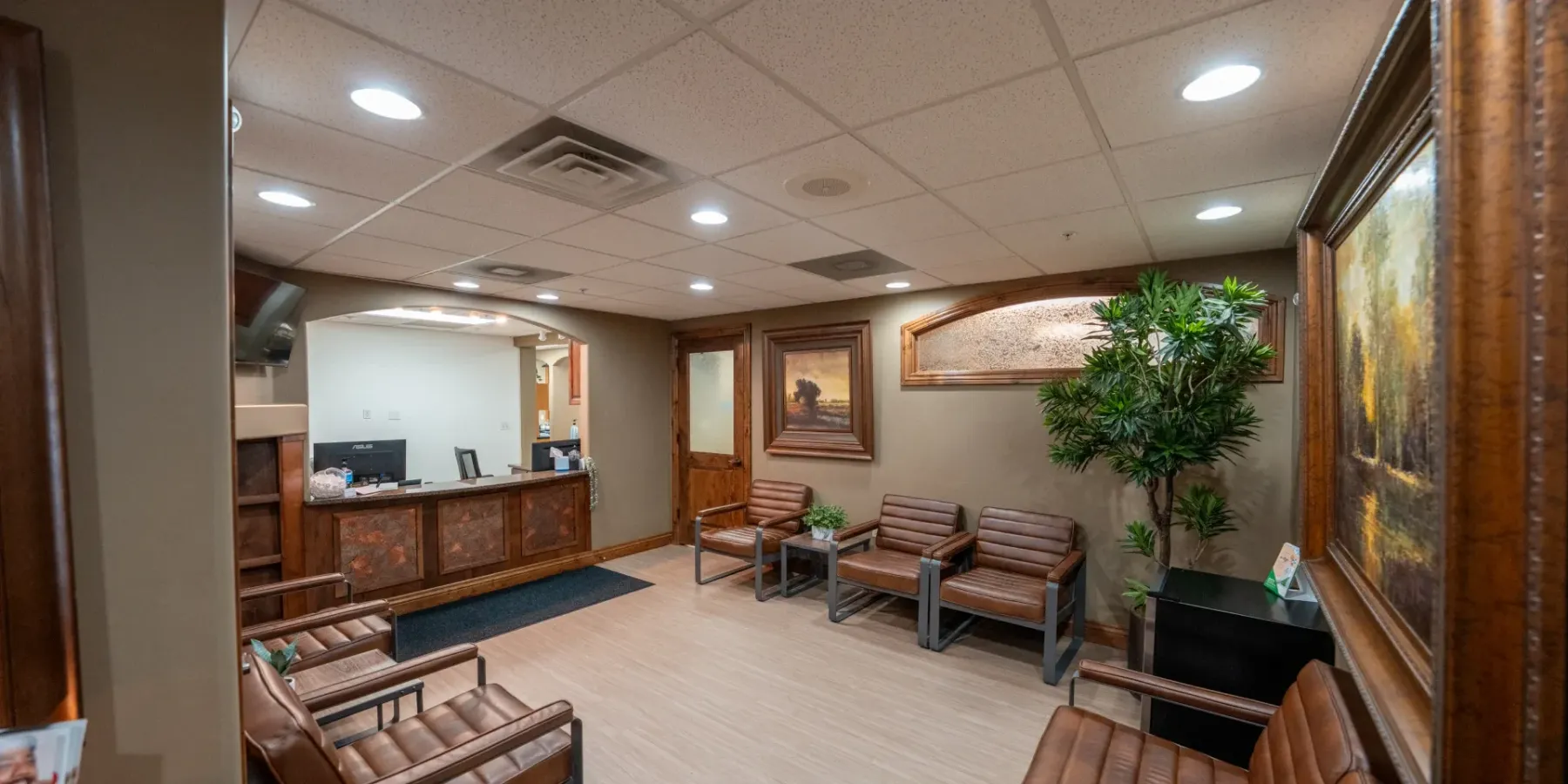Redwood waiting room with bench seating and framed artwork | Complete Smiles-Cottonwood Heights-Mountain View-Redwood-Utah