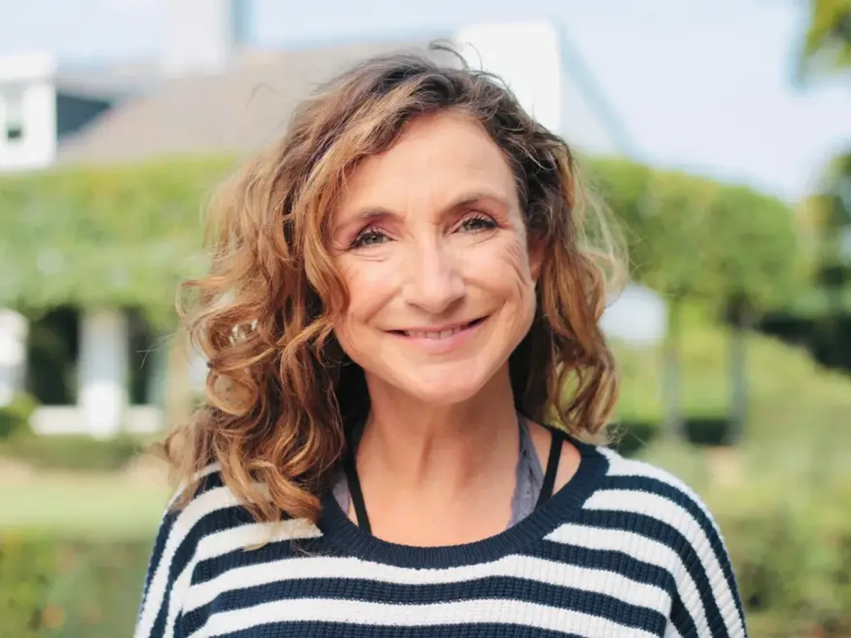 A smiling older woman seated at home | Complete Smiles-Cottonwood Heights-Mountain View-Redwood-Utah