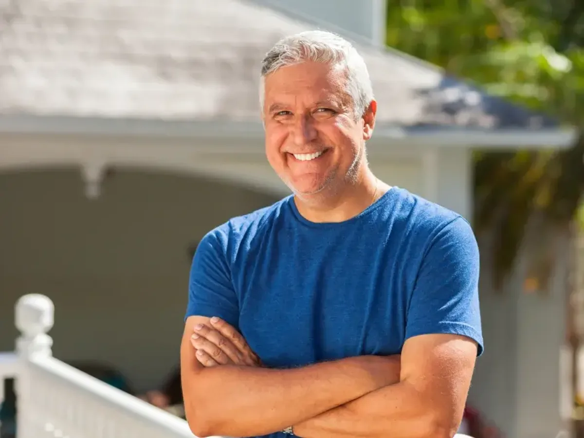 A man in his fifties smiling at home | Complete Smiles-Cottonwood Heights-Mountain View-Redwood-Utah