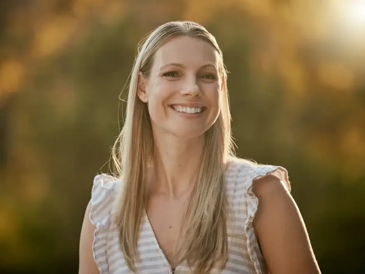 A woman in her forties smiling after restorative treatment | Complete Smiles-Cottonwood Heights-Mountain View-Redwood-Utah