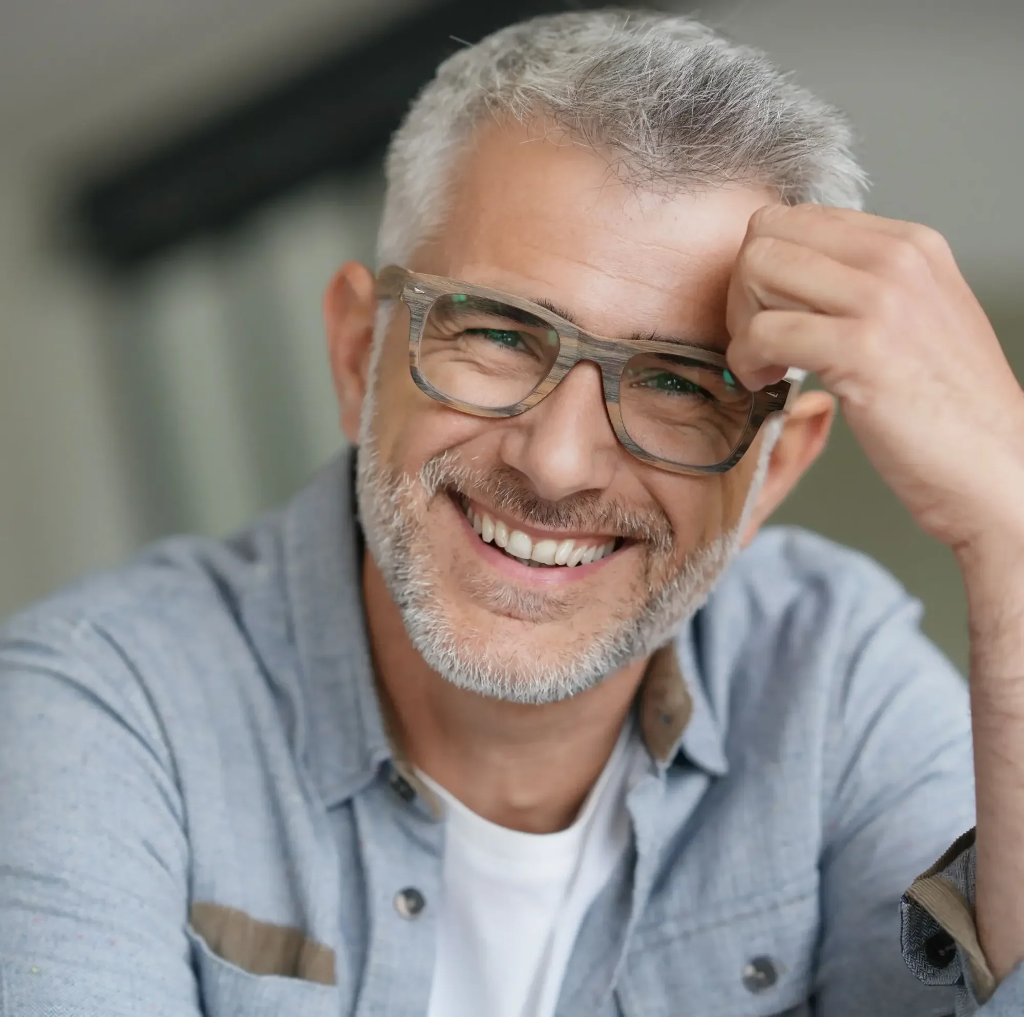 A man in his fifties smiling, wearing glasses | Complete Smiles-Cottonwood Heights-Mountain View-Redwood-Utah