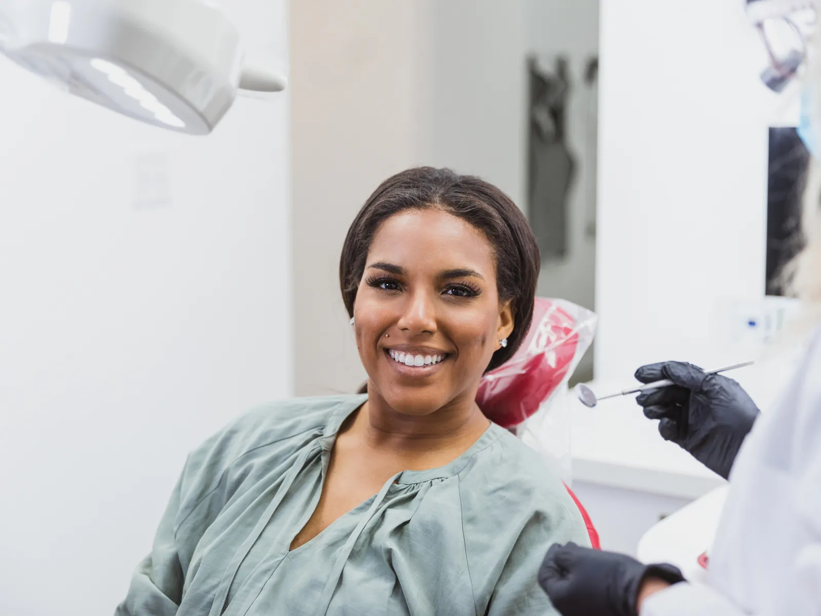 A hygienist cleaning a patient’s teeth during a routine checkup | Complete Smiles-Cottonwood Heights-Mountain View-Redwood-Utah